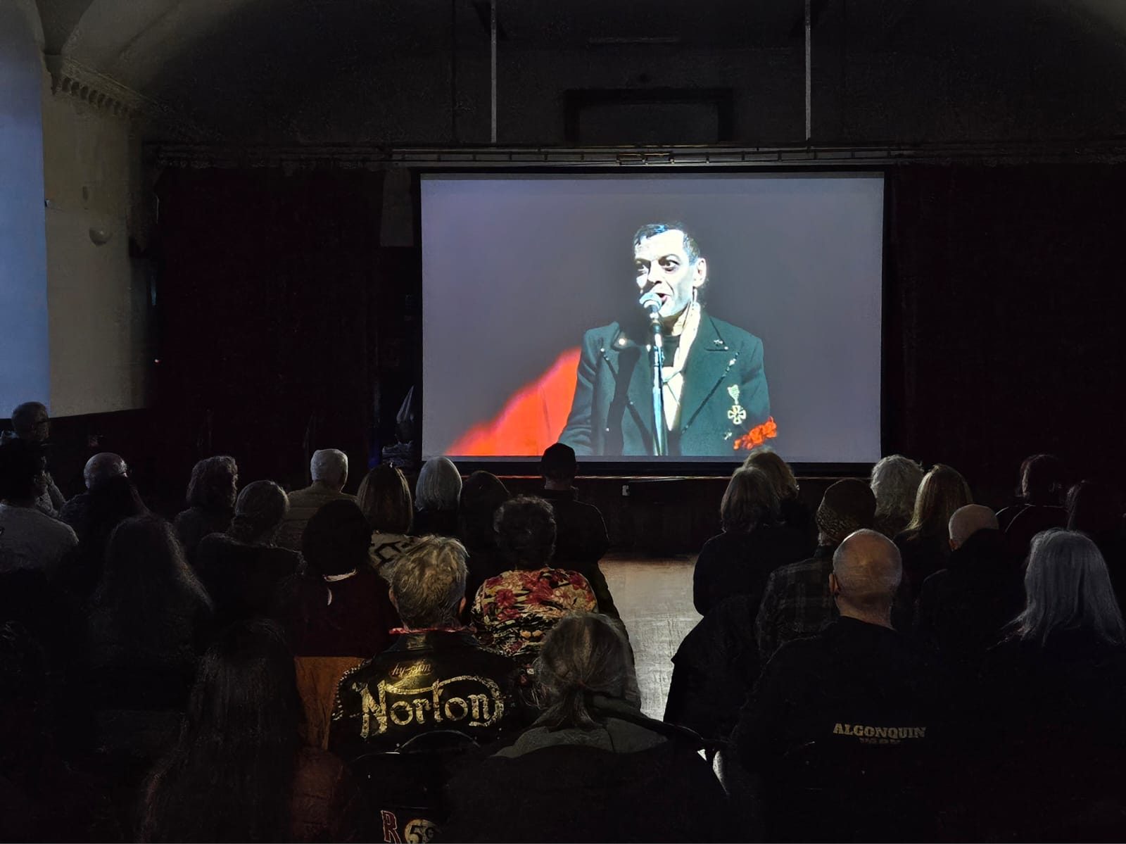 A full house watching a film on the big screen
